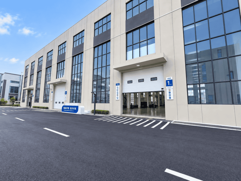 overhead door replacement with vertical lift sectional doors at an environmental equipment factory