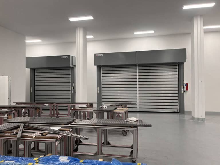 rigid commercial high cycle doors installed at a SCHNEEBERGER production workshop